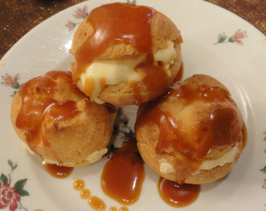 France Famous Profiteroles with cardamom crème fraîche and orange toffee sauce